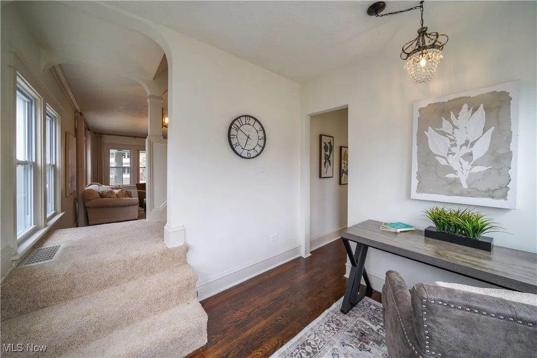 First floor office space with restored hardwood floors, crystal chandelier and new windows.