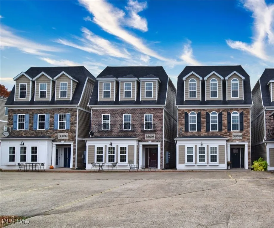View of front facade featuring stone siding