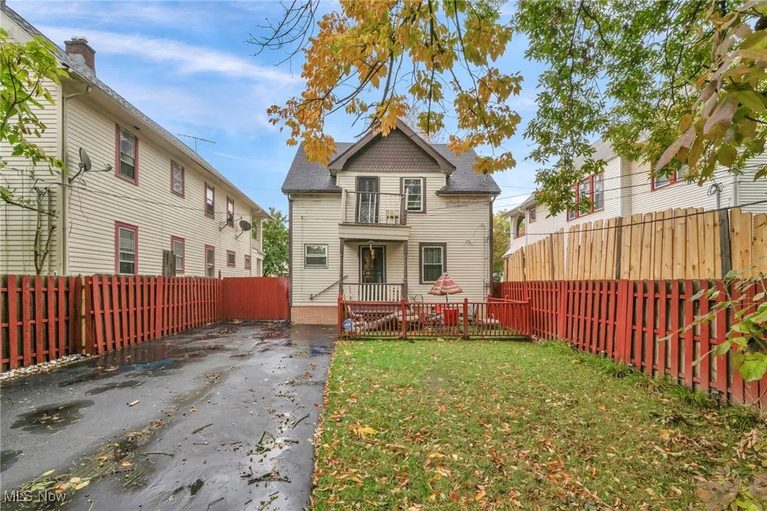 Back of house with a fenced backyard