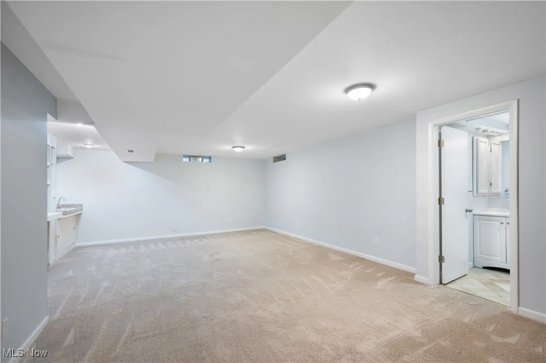 Finished basement with light carpet