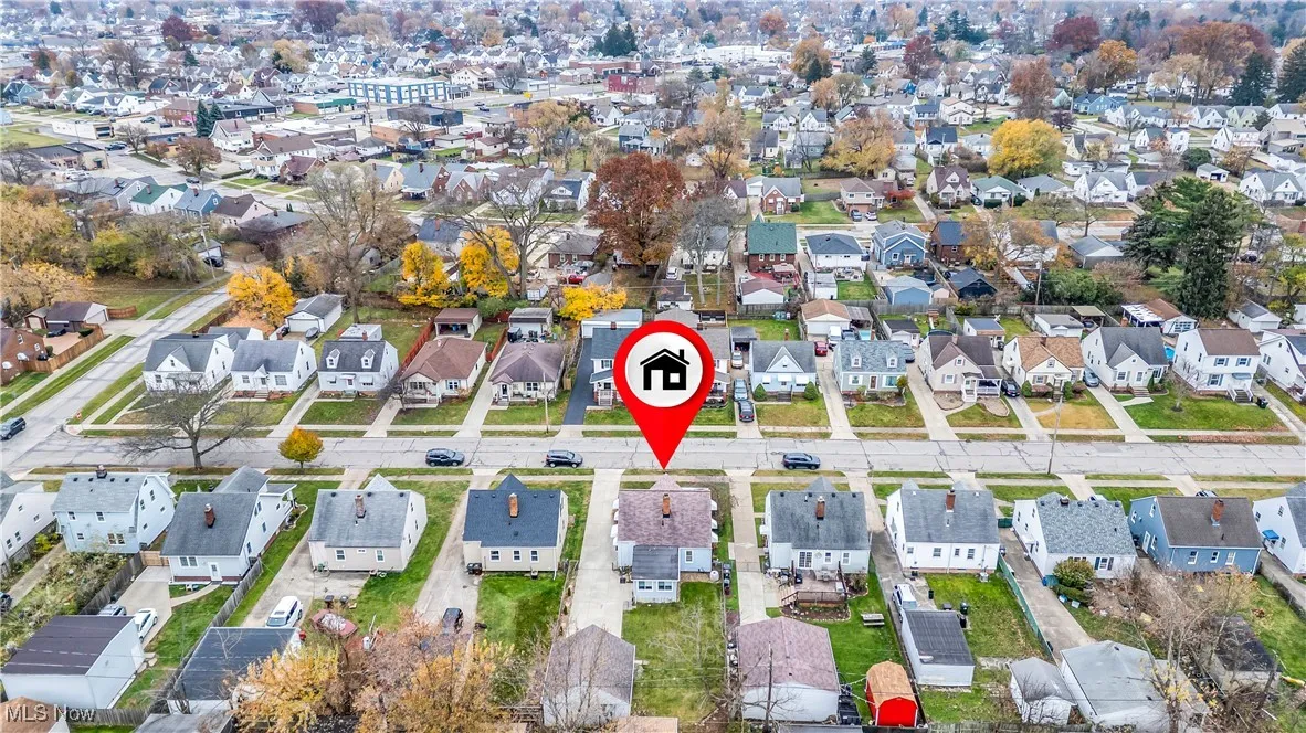 Aerial view of property's location featuring nearby suburban area