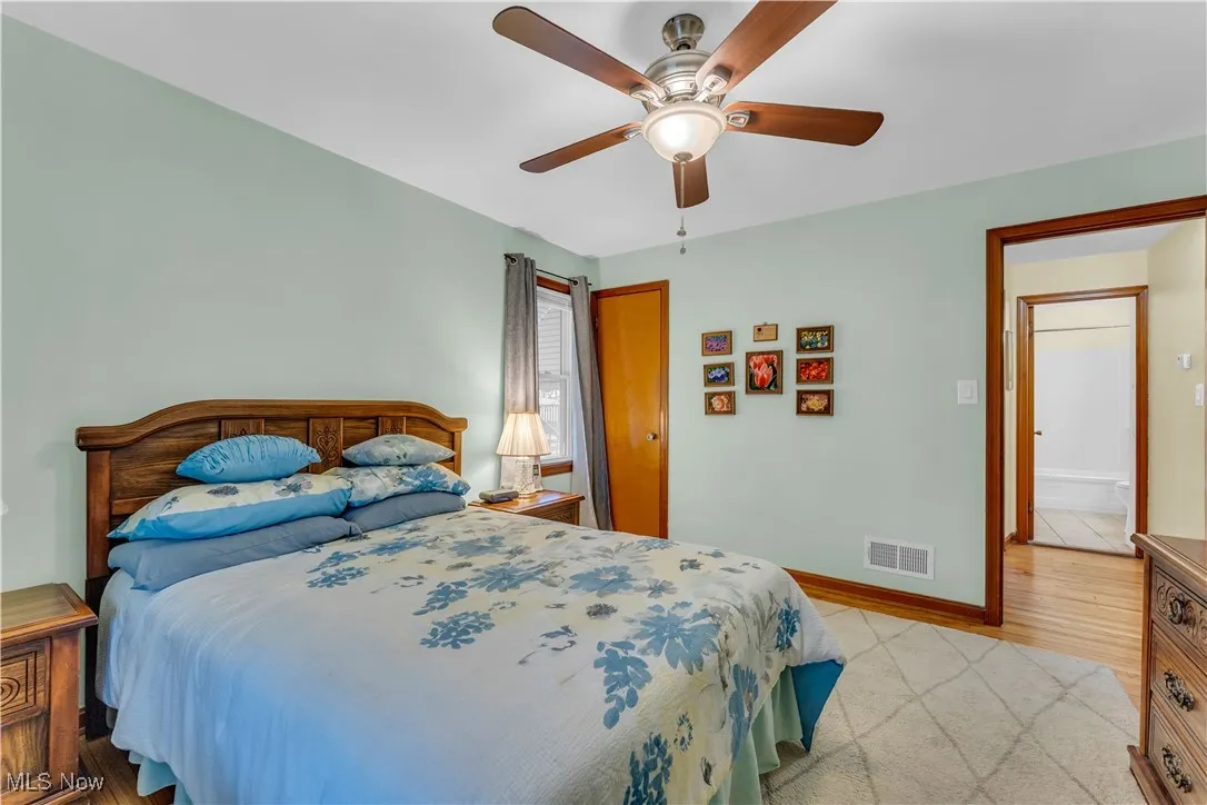 Bedroom with a ceiling fan and baseboards