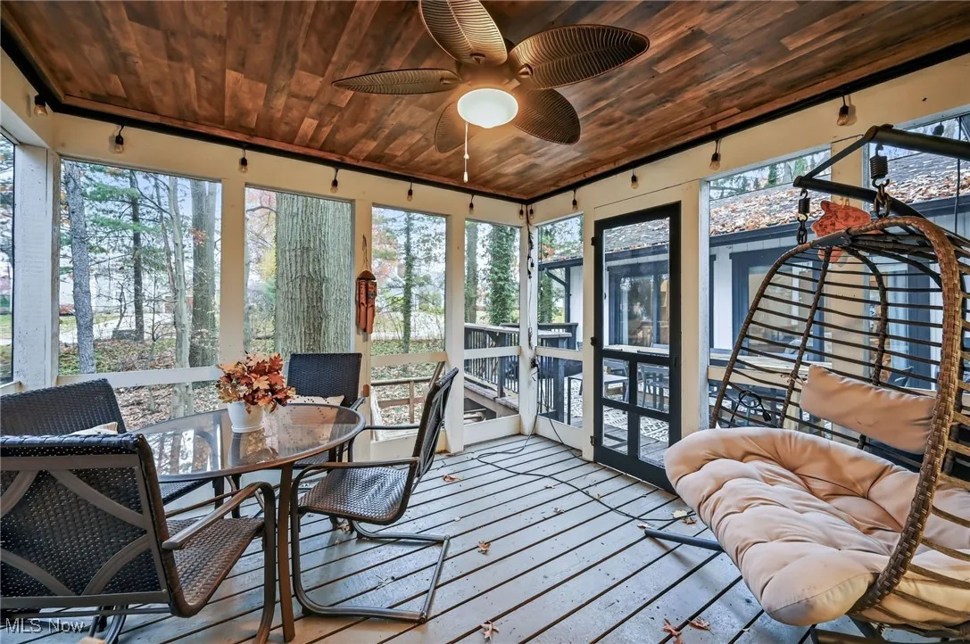 Screened porch off the deck is a great space for enjoying the outdoors with family or friends