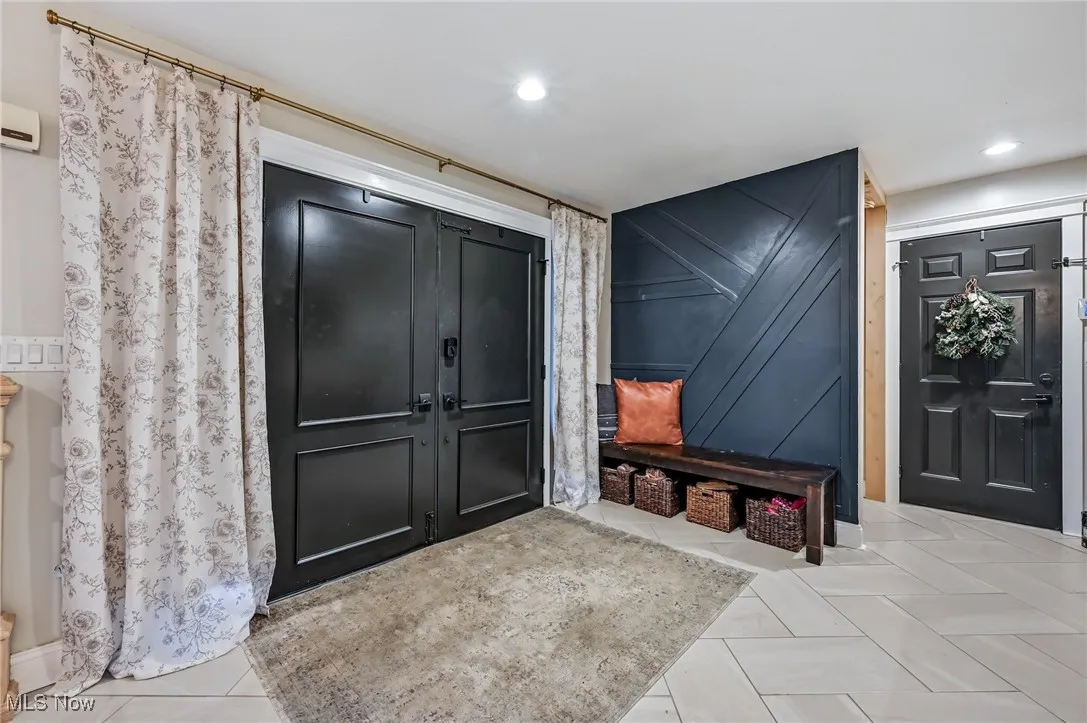 Spacious foyer with double door entry