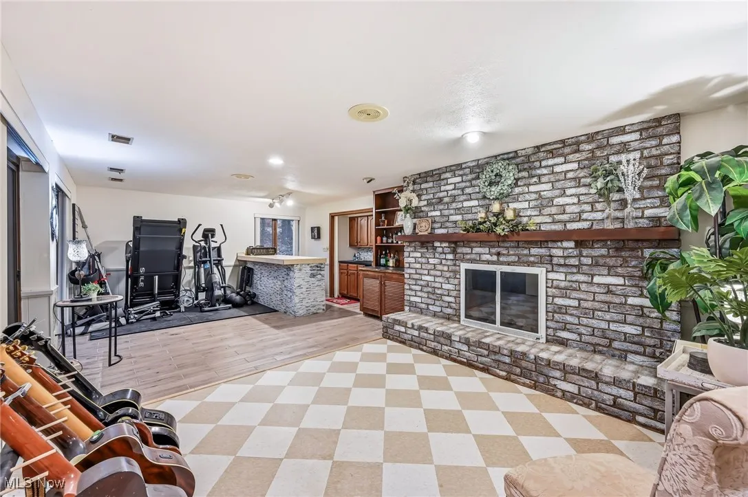 Rec room with brick fireplace