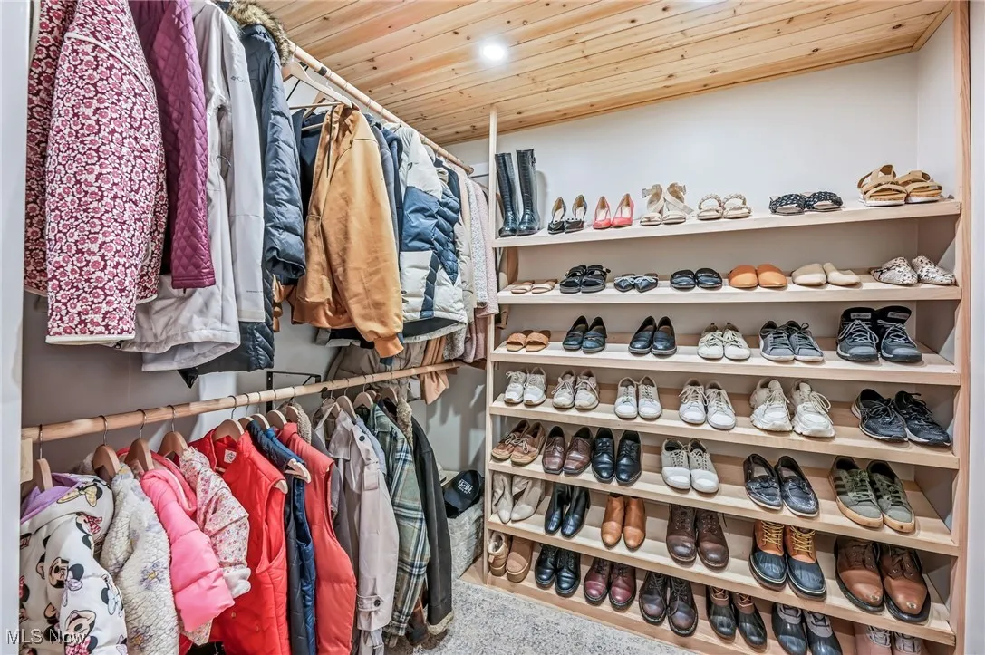 Walk in hall closet keeps all your outerwear organized!