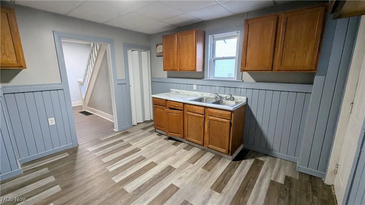 Kitchen with rear door to the deck and backyard