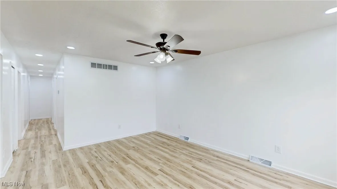 Spare room with recessed lighting, light wood-type flooring, and ceiling fan