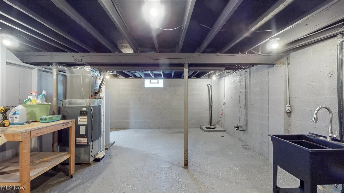 Below grade area featuring drainage system and heating unit