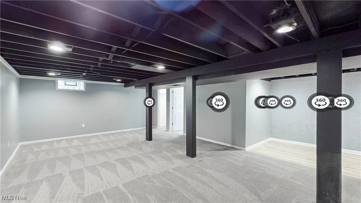 Below grade area with baseboards and carpet floors