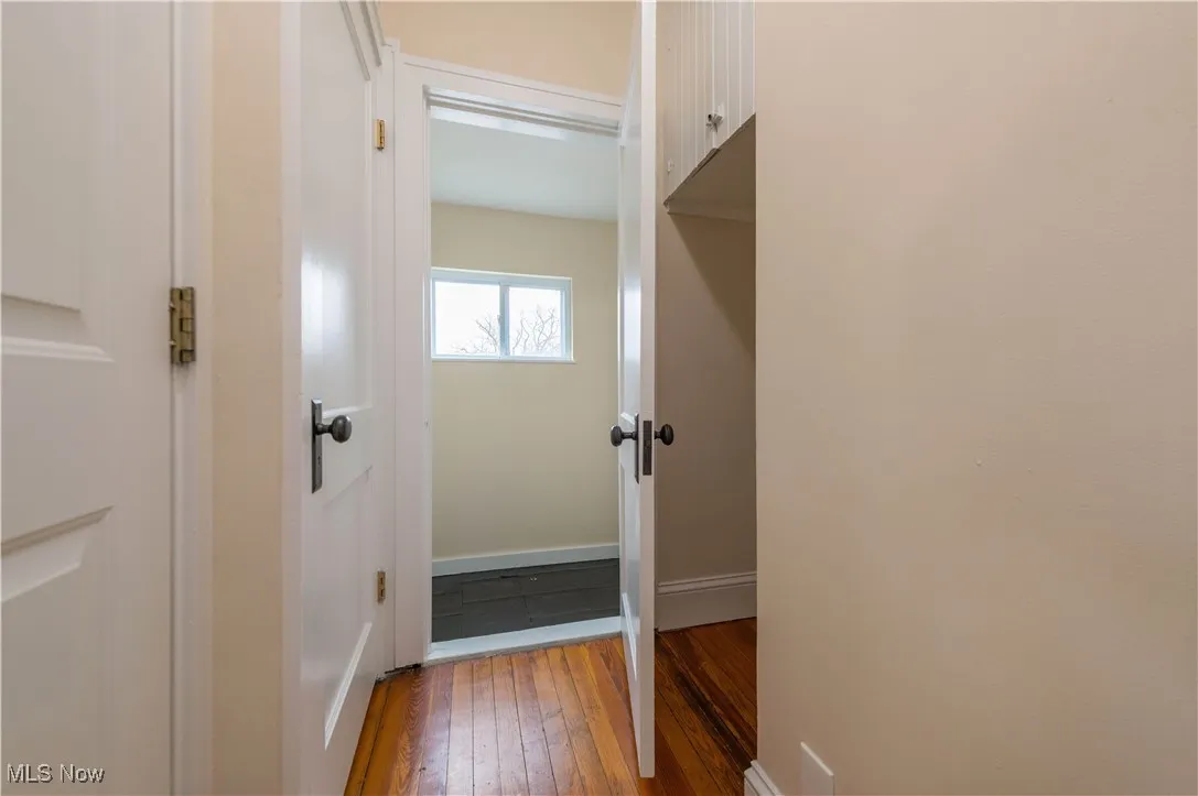 Doorway to outside with hardwood / wood-style floors and baseboards