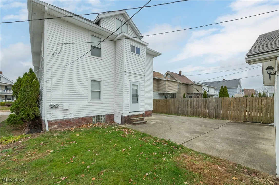 Rear view of house featuring a patio area and entry steps