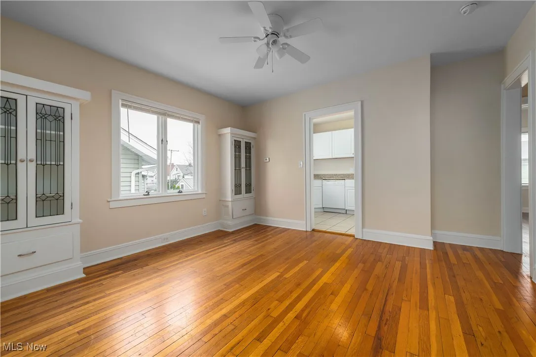 Unfurnished bedroom featuring light wood-style flooring and a ceiling fan