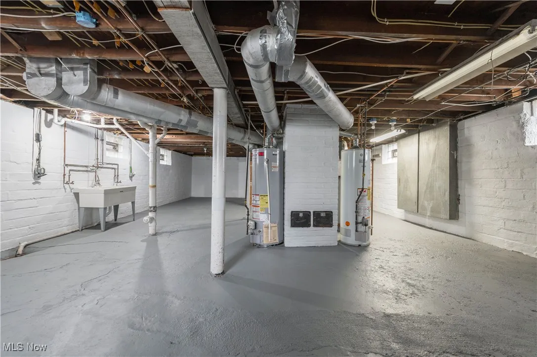 Unfinished basement with gas water heater