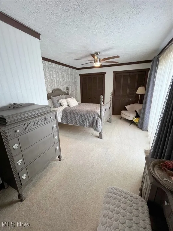 Masterbedroom with full bath and sliding glass doors to deck