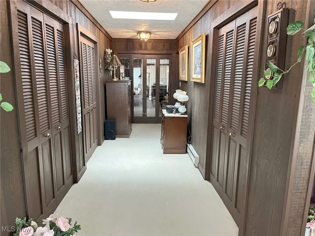 Hallway adjoining living room area and dining room