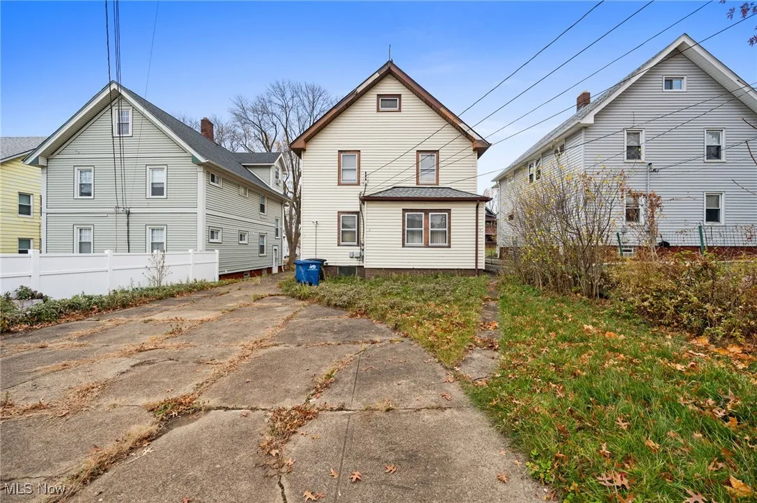 Back of property with driveway