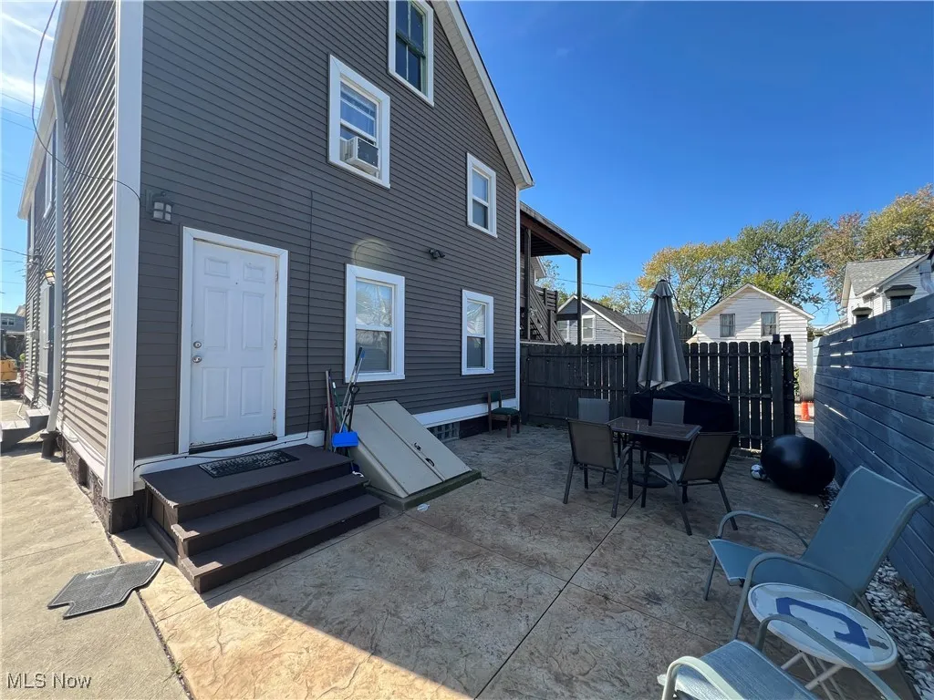 Back of house featuring a patio area and outdoor dining space