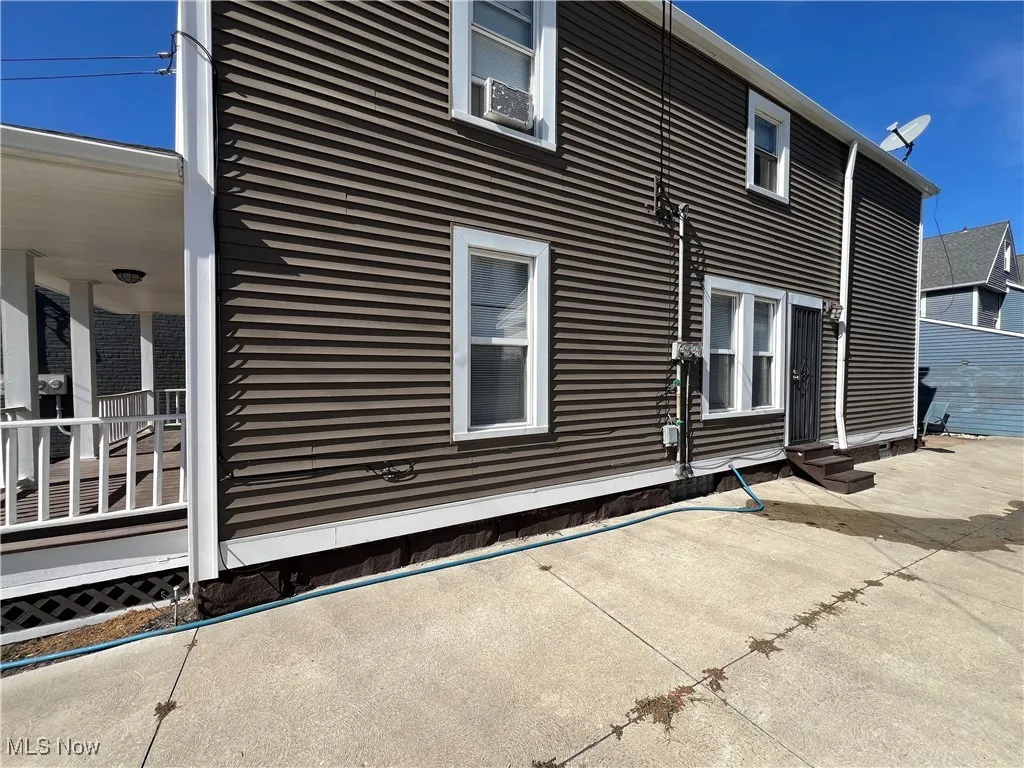 View of property exterior with entry steps