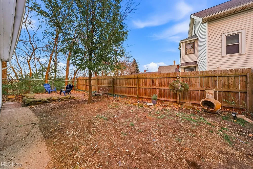 Fenced backyard with a patio area