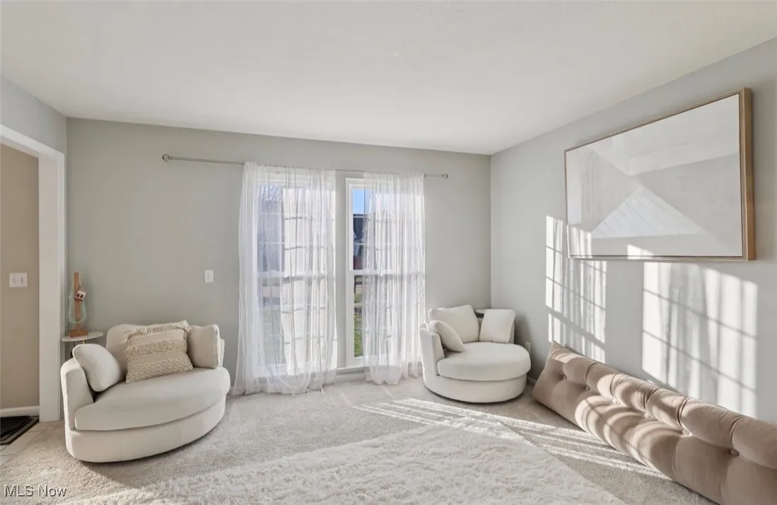 Sitting room featuring carpet