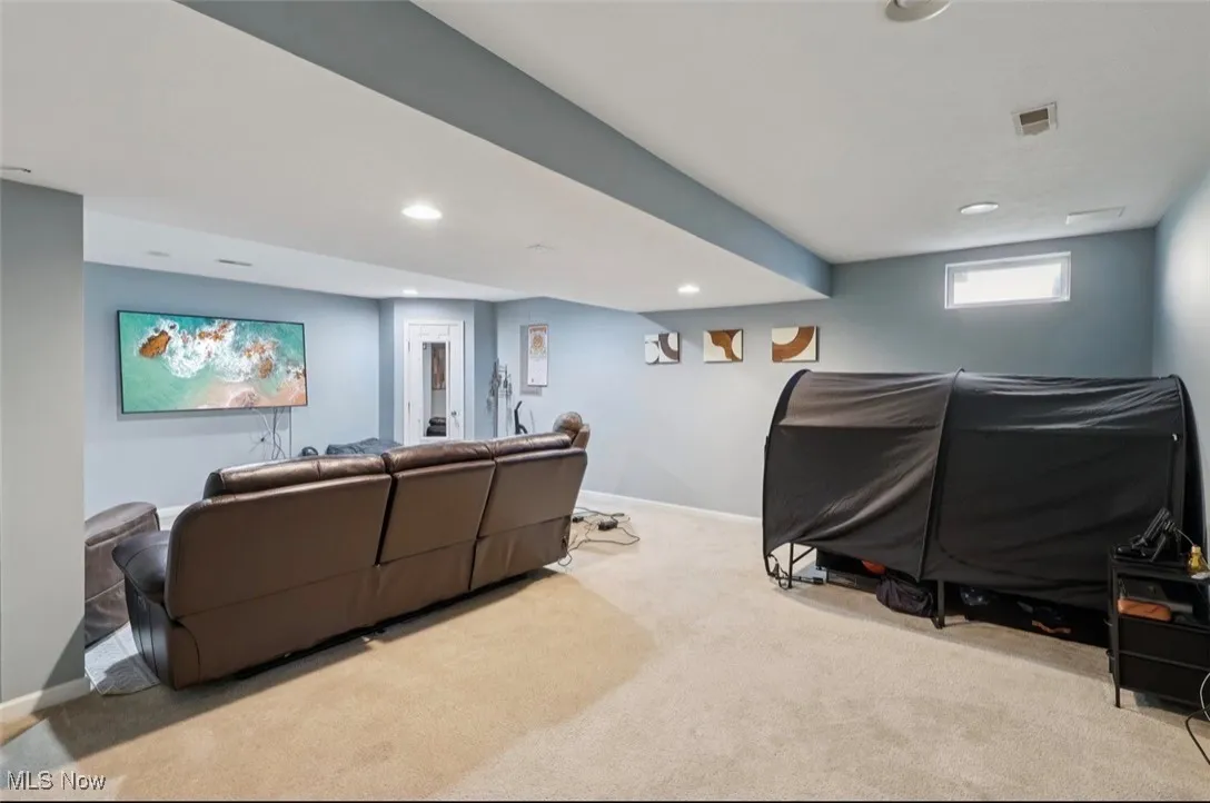 Living room with carpet and recessed lighting