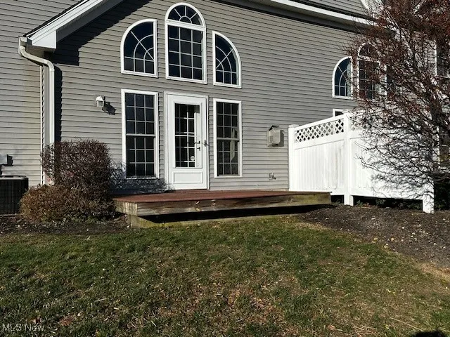 Back of house featuring a wooden deck