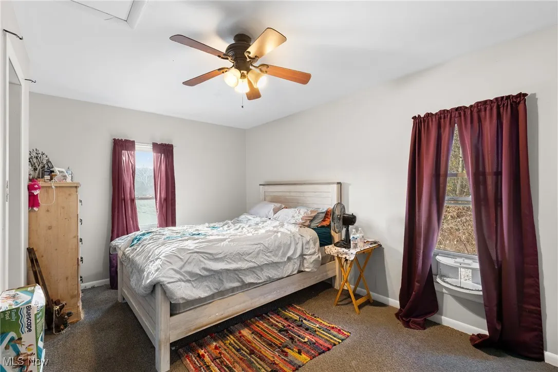 Bedroom featuring carpet flooring and a ceiling fan
