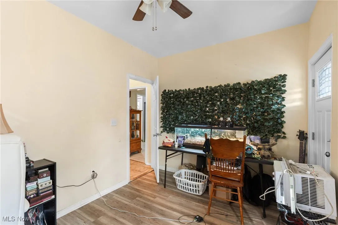 Home office featuring light wood-style floors and ceiling fan