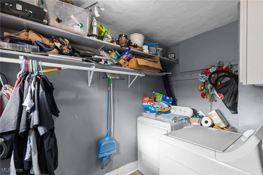 Laundry room featuring separate washer and dryer