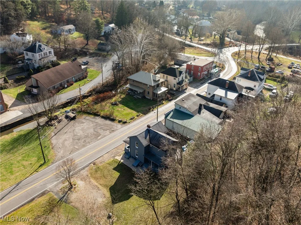 Aerial overview of property's location with nearby suburban area