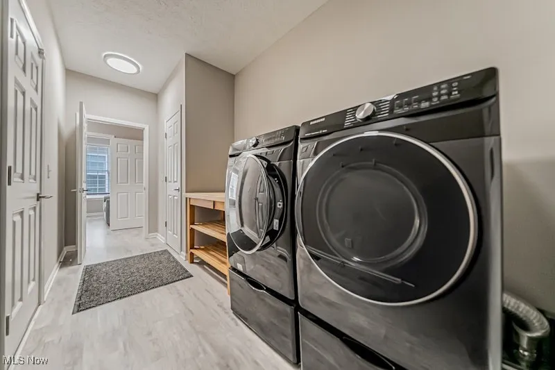 Off garage and main hall.  Appliances stay.
