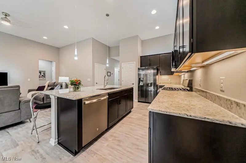 Huge island, stainless appliances stay