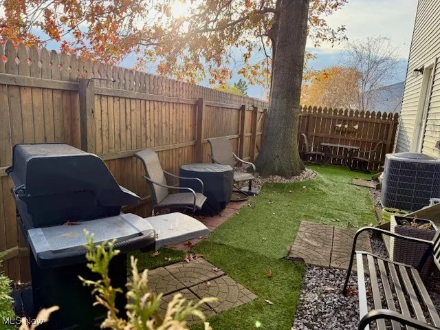 Extra large, private fenced patio to use for grilling, entertaining, and garden area with separate entrance from garage and dining room.  Has exit door to spacious back yard area that can be used for cookouts.  Opens to a very spacious, safe open area for children to play.