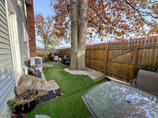 Extra large, private fenced patio to use for grilling, entertaining, and garden area with separate entrance from garage and dining room.  Has exit door to spacious back yard area that can be used for cookouts.  Opens to a very spacious, safe open area for children to play.