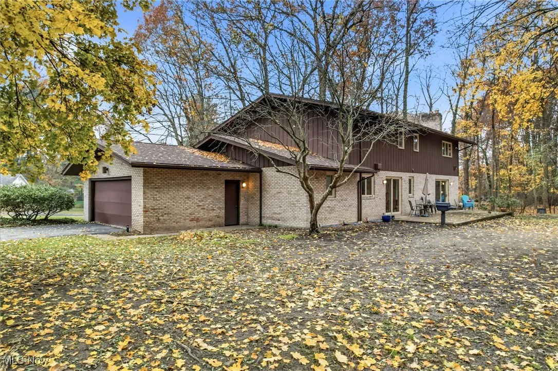 View of side entry 2+ car garage with rear entry door