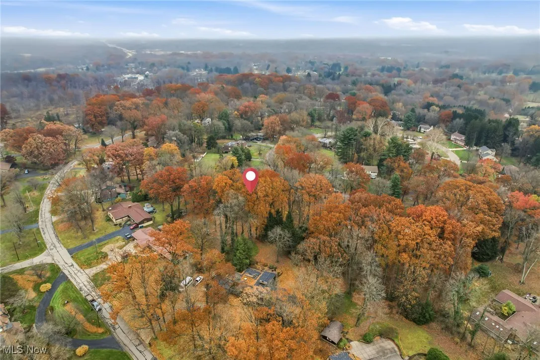 View of property location featuring a heavily wooded area