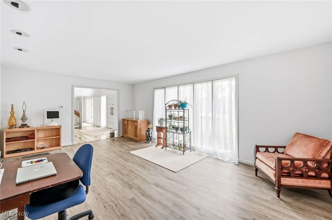  Living Room or a great office area! beautiful windows and lots of light