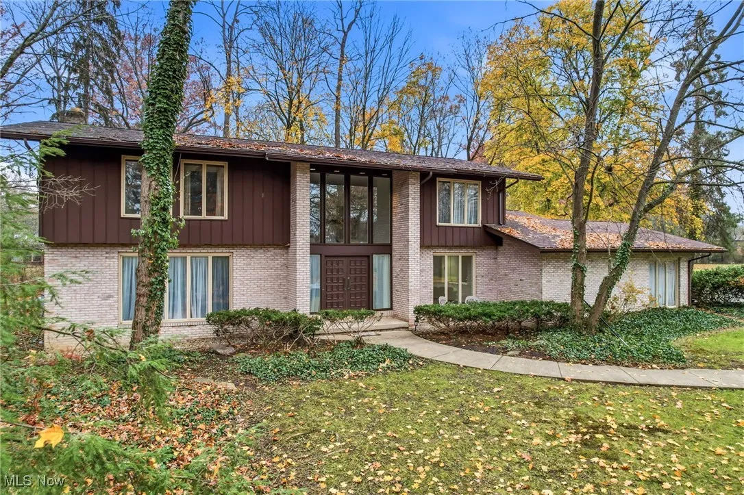 Modern brick and cedar home with lots of windows. A beautiful view from every room!