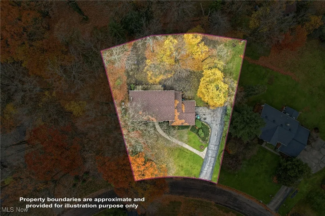 Aerial view of property and surrounding area with property parcel outlined