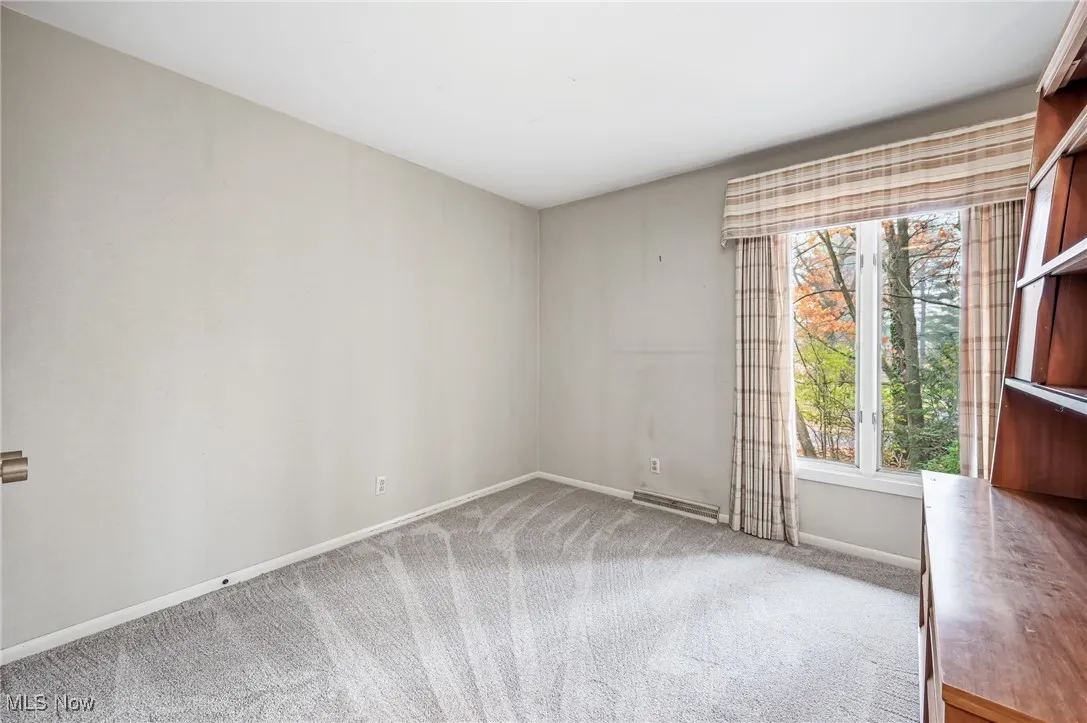 Bedroom with light colored carpet