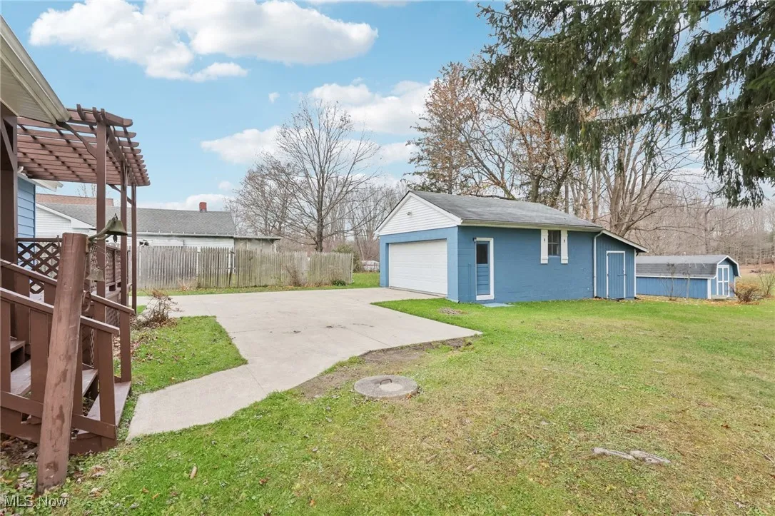 View of yard with an outbuilding and a patio