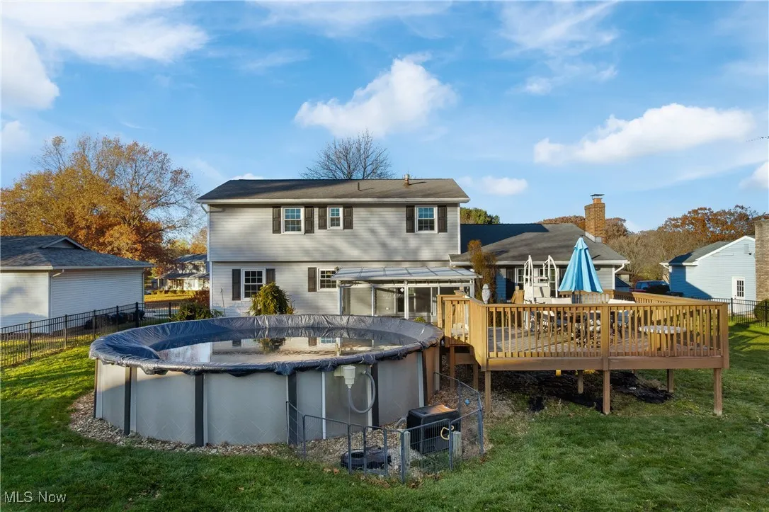 Rear view of house with a wooden deck