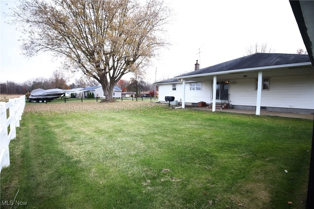 View of fenced backyard