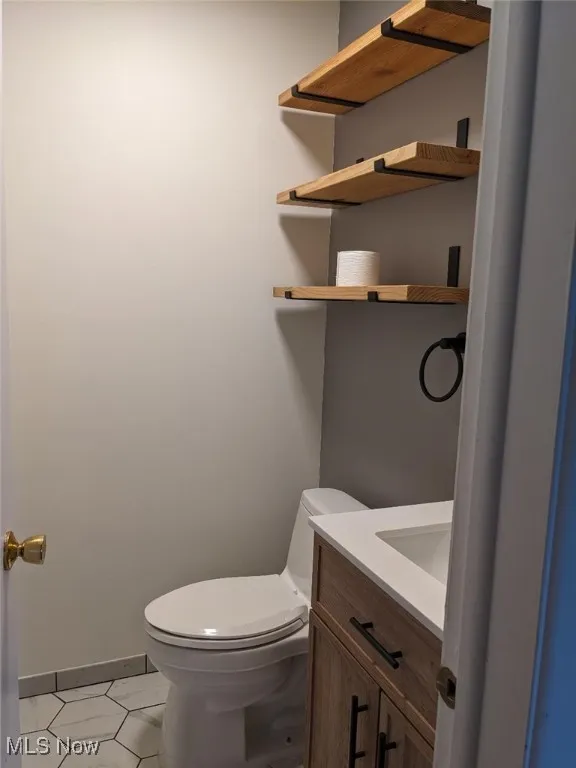 Bathroom with vanity and light tile patterned flooring