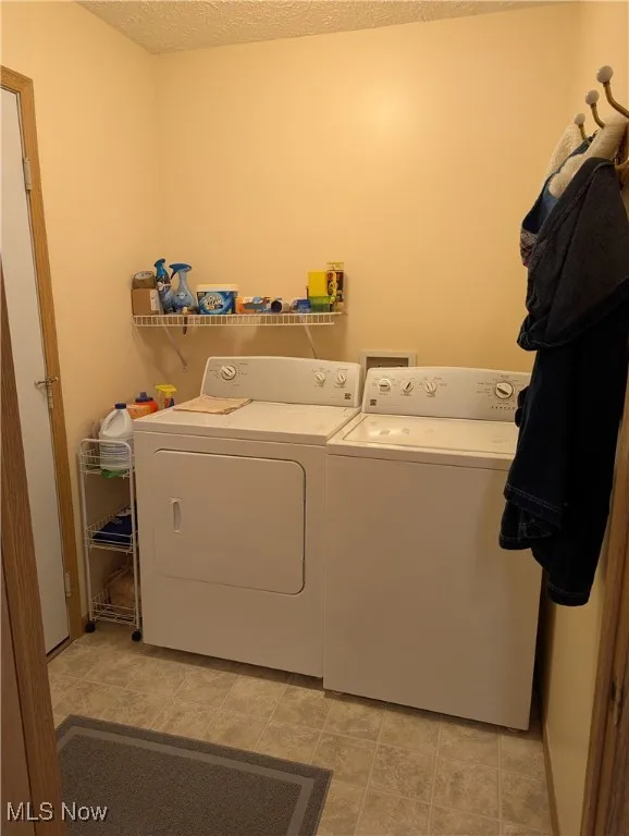 Laundry room off of kitchen leading to garage