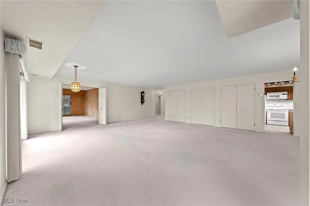 Unfurnished living room with carpet flooring