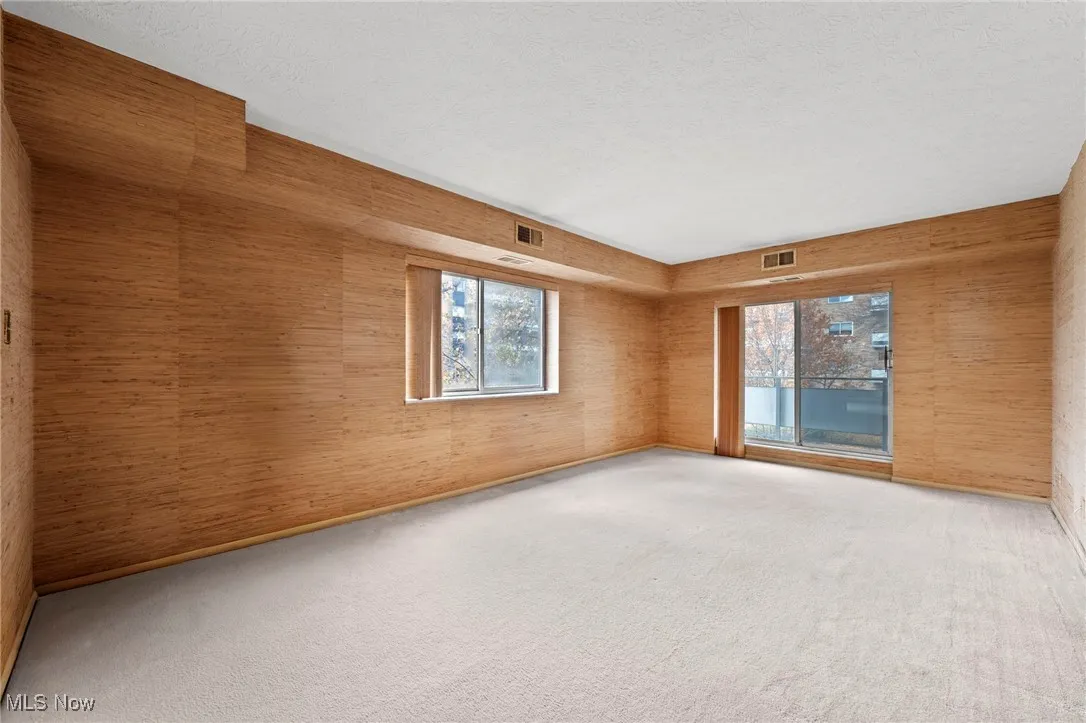 Den, Office, or Third Bedroom with a textured ceiling, carpet, and views