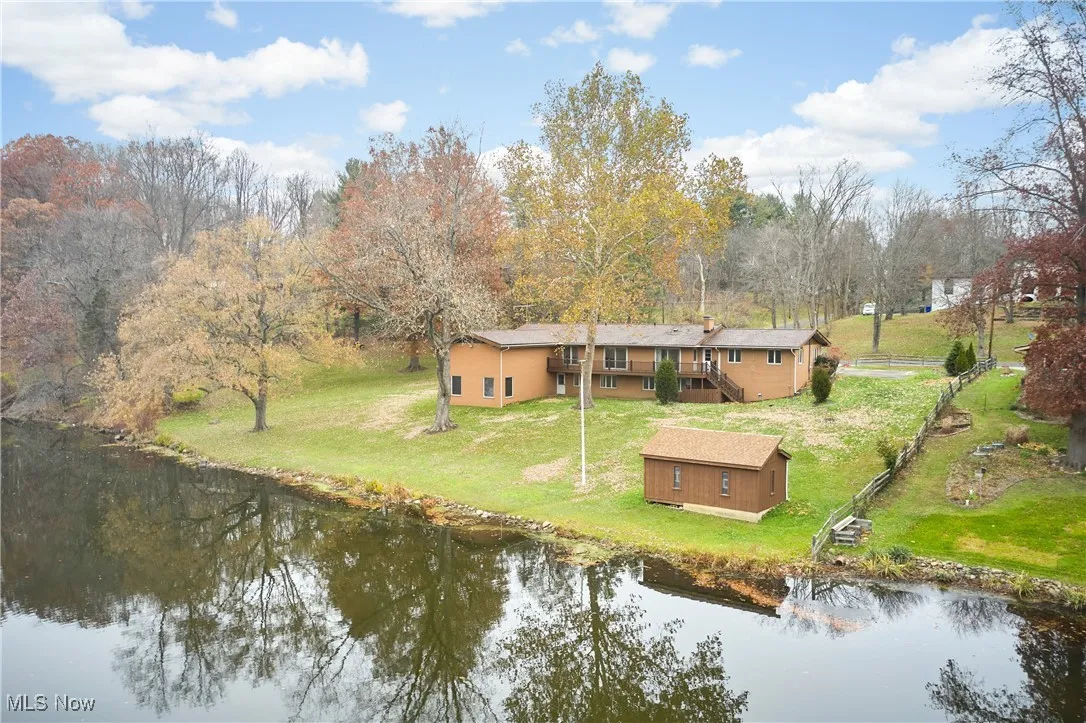 Rear view of house with a water view