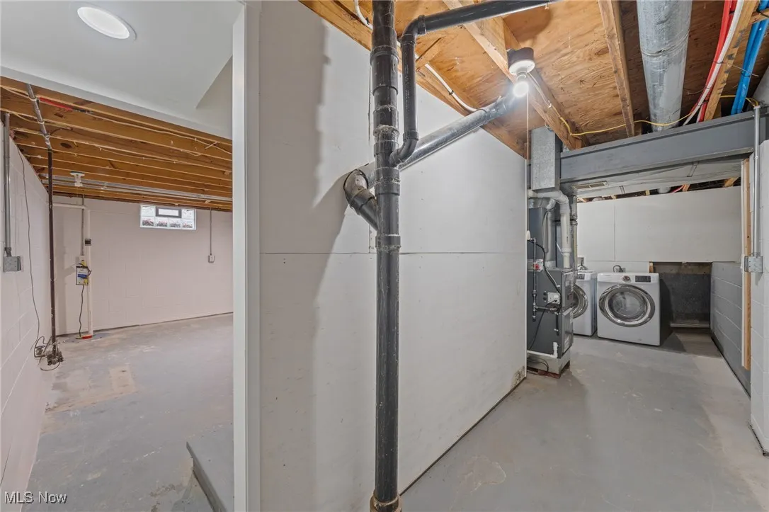 Below grade area with independent washer and dryer and heating unit